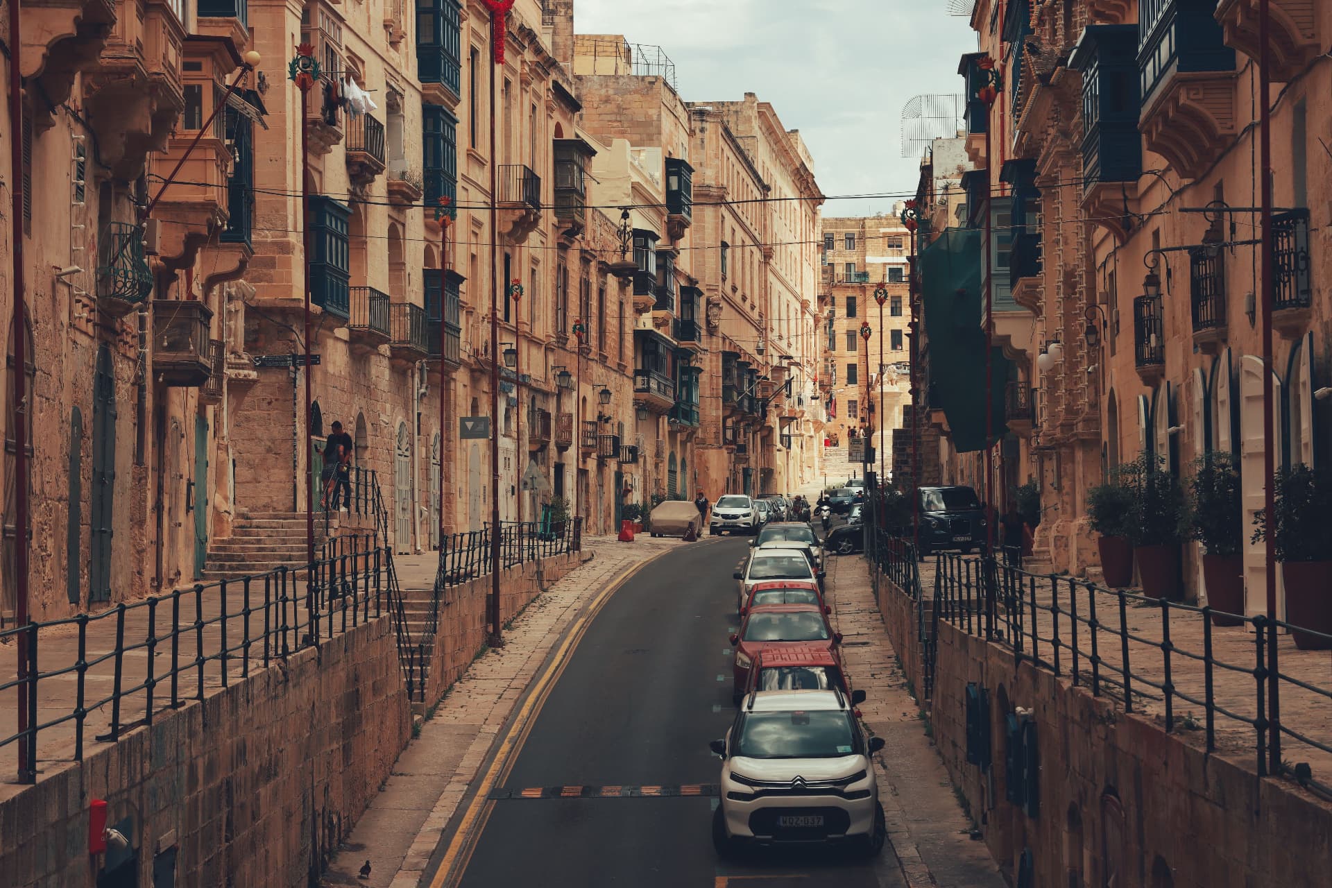 A historic street lined with Maltese balconies in Valletta